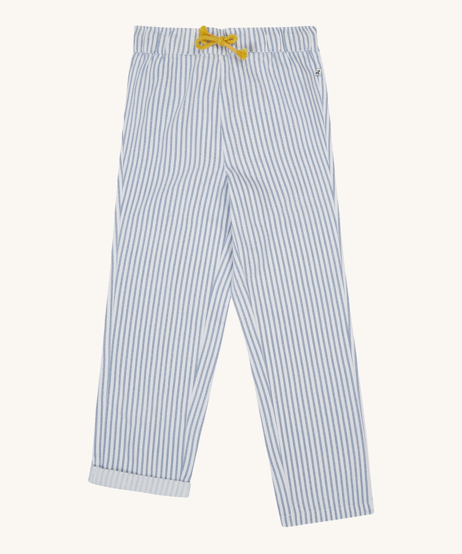 Frugi blue and white striped trousers on a cream background.