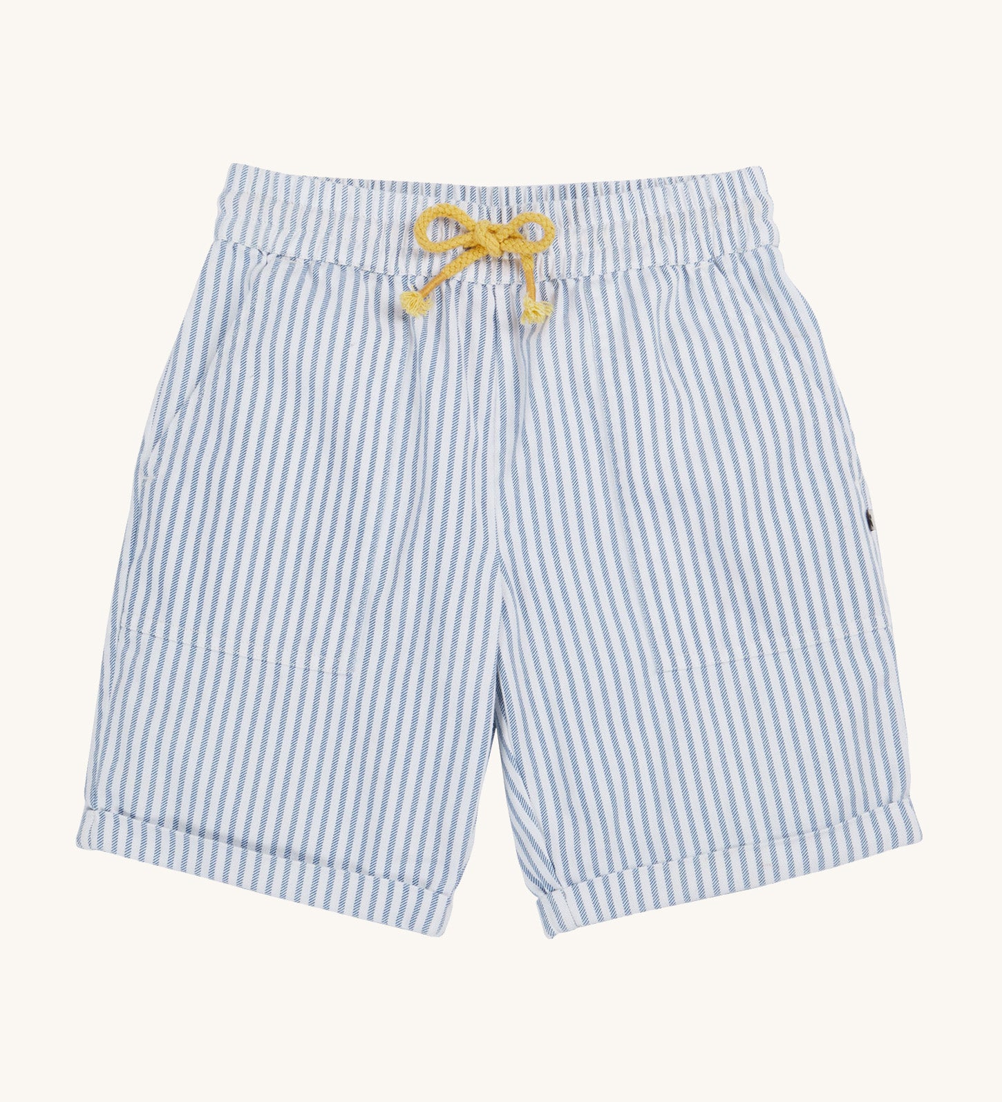 Frugi blue and white striped shorts on a cream background.