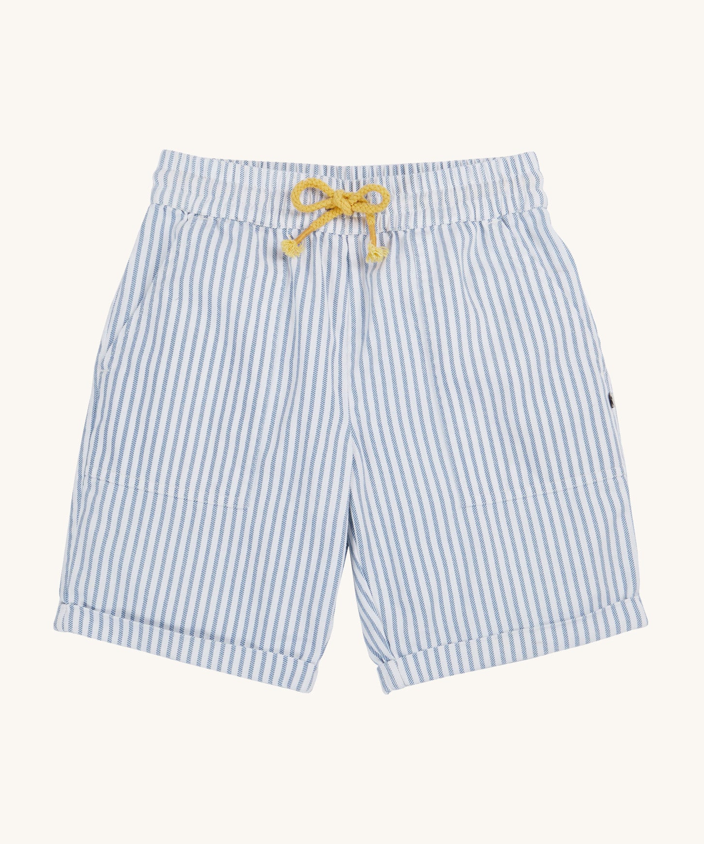 Frugi blue and white striped shorts on a cream background.