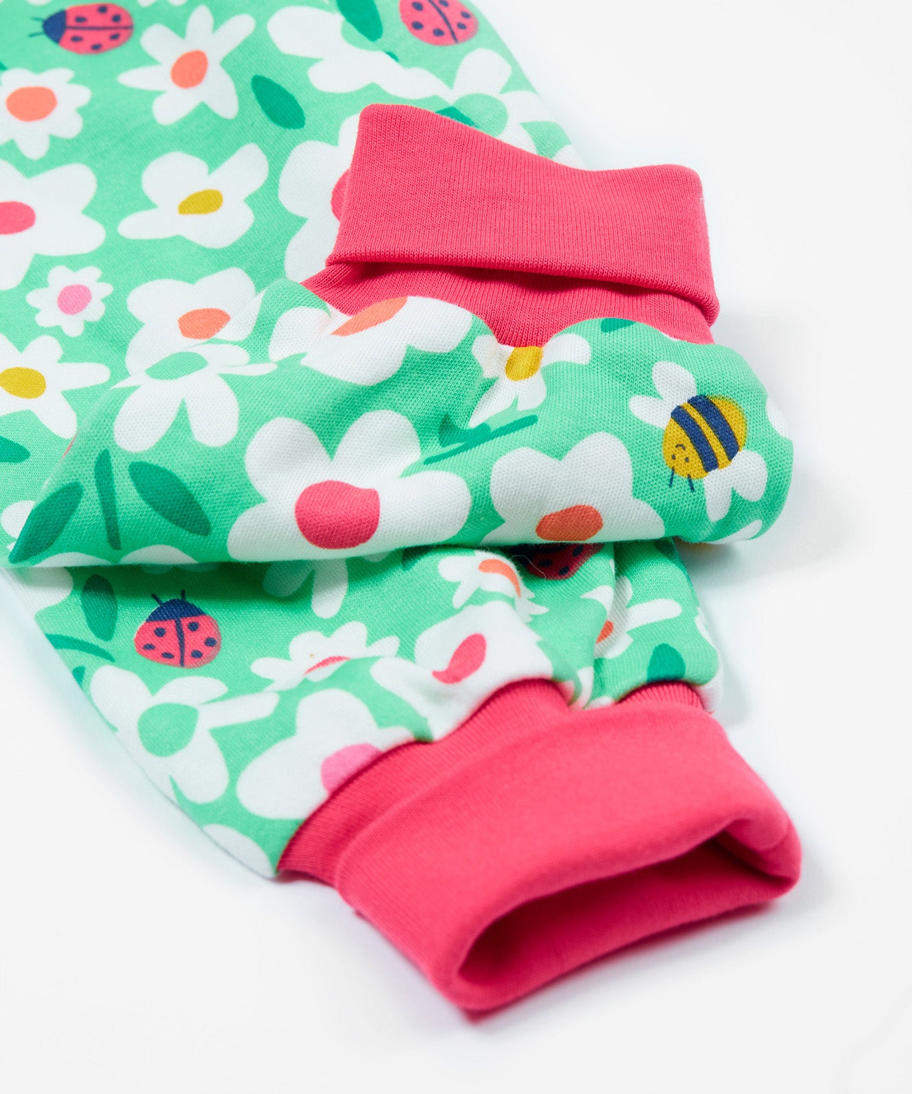 Frugi green parsnip pants busy bugs cuff detail