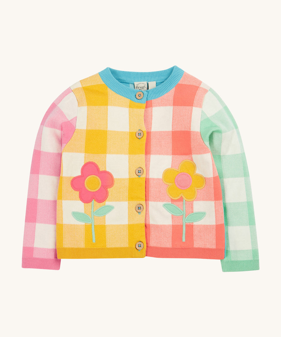 Frugi multicoloured check cardigan daisy design on a cream background.