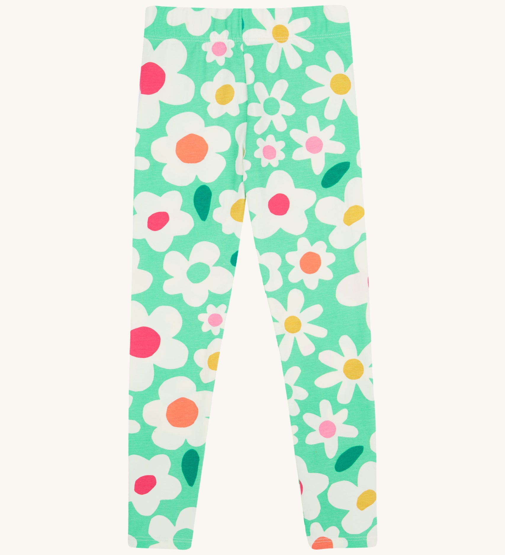 Frugi green leggings daisy design on a cream background.