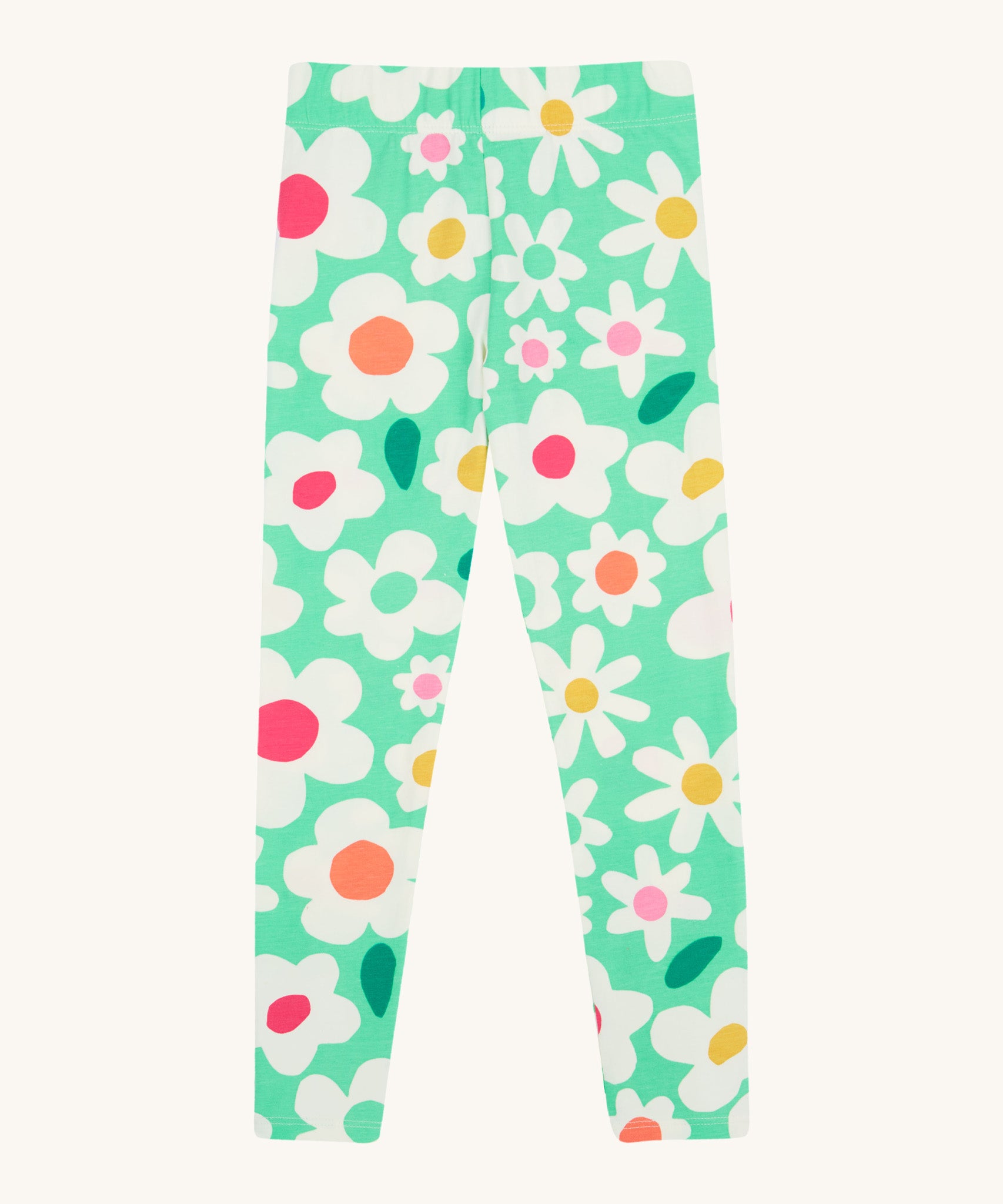 Frugi green leggings daisy design on a cream background.