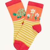 Frugi single little sock daisy design on a cream background