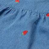 Frugi blue denim dress strawberry design print detail