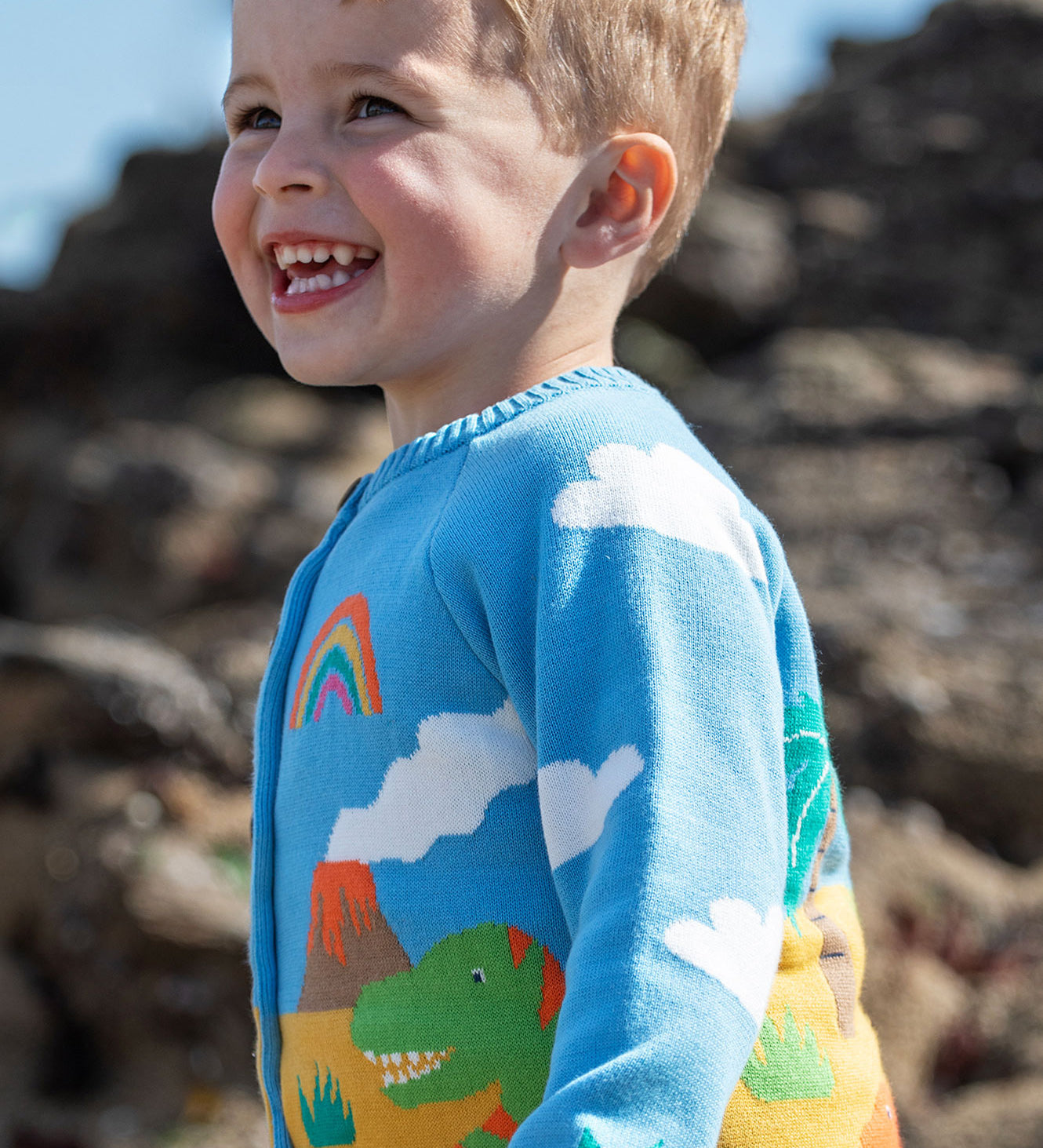 Frugi blue knitted cardigan dino design.