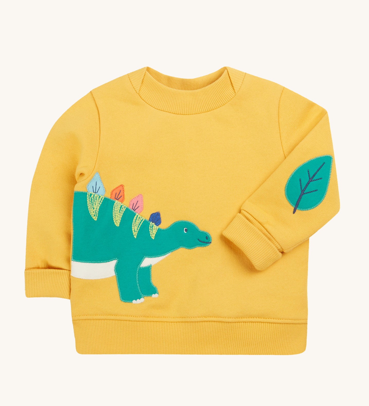 Frugi yellow easy on jumper dino design on a cream background.