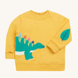 Frugi yellow easy on jumper dino design on a cream background.