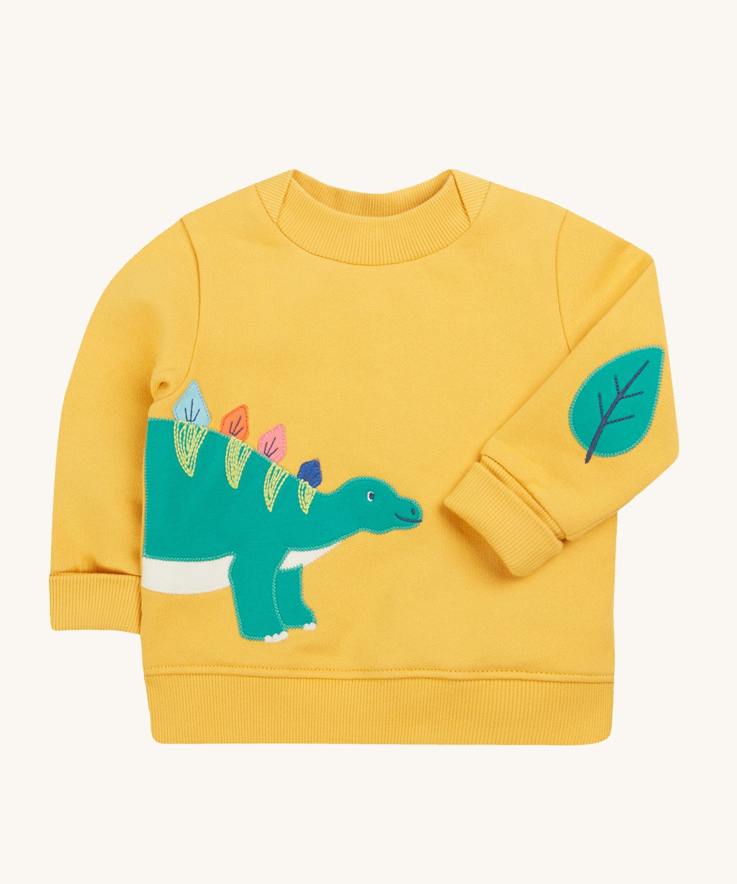 Frugi yellow easy on jumper dino design on a cream background.