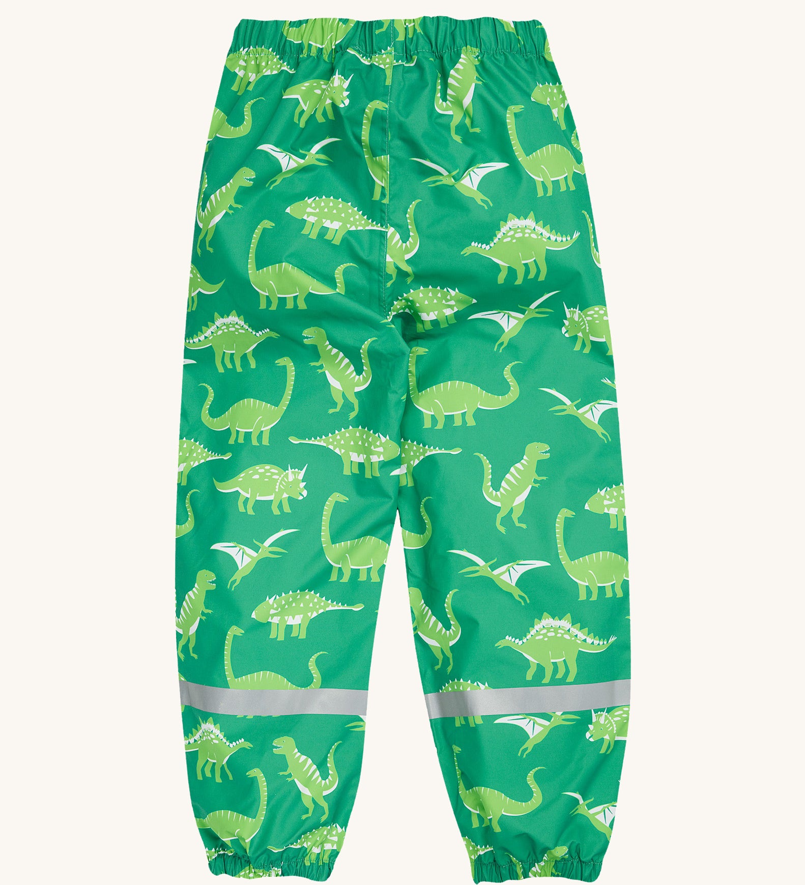 Frugi green rain and shine trousers dino roar design on a cream background.