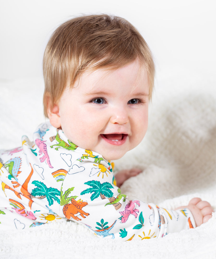 Frugi white baby grow dino land design