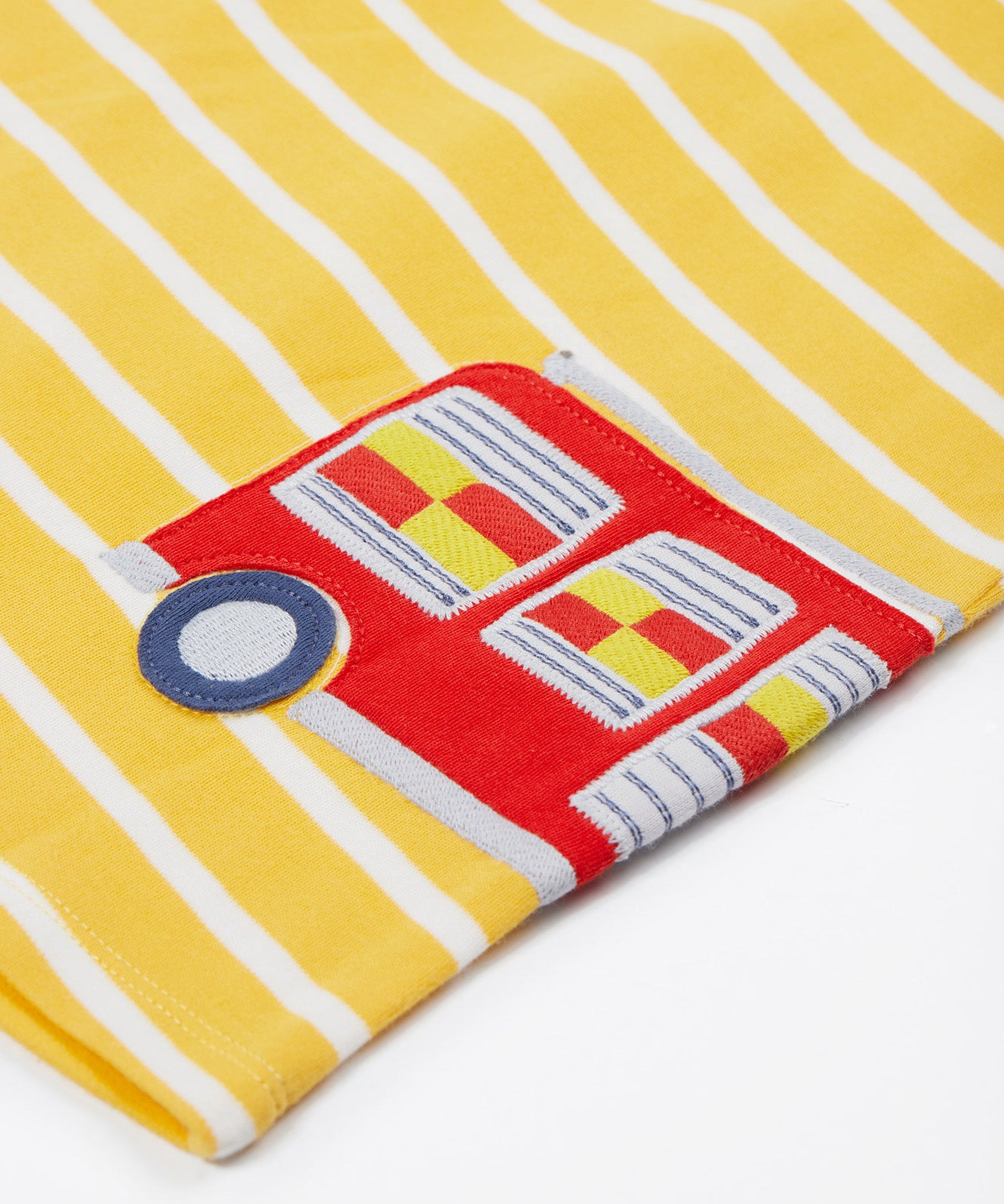 Frugi yellow striped dress fire engine design print detail