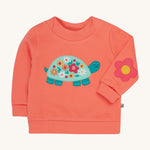 Frugi pink easy on jumper tortoise design on a cream background.