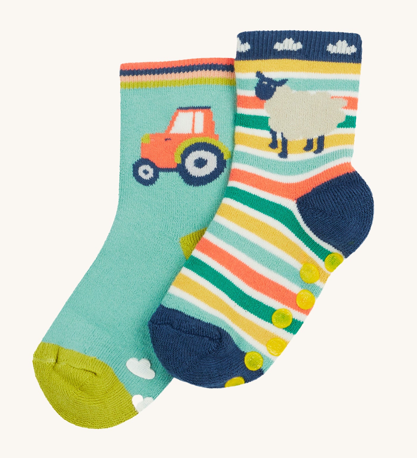 Frugi 2 pack grippy socks tractor and sheep design on a cream background