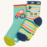 Frugi 2 pack grippy socks tractor and sheep design on a cream background