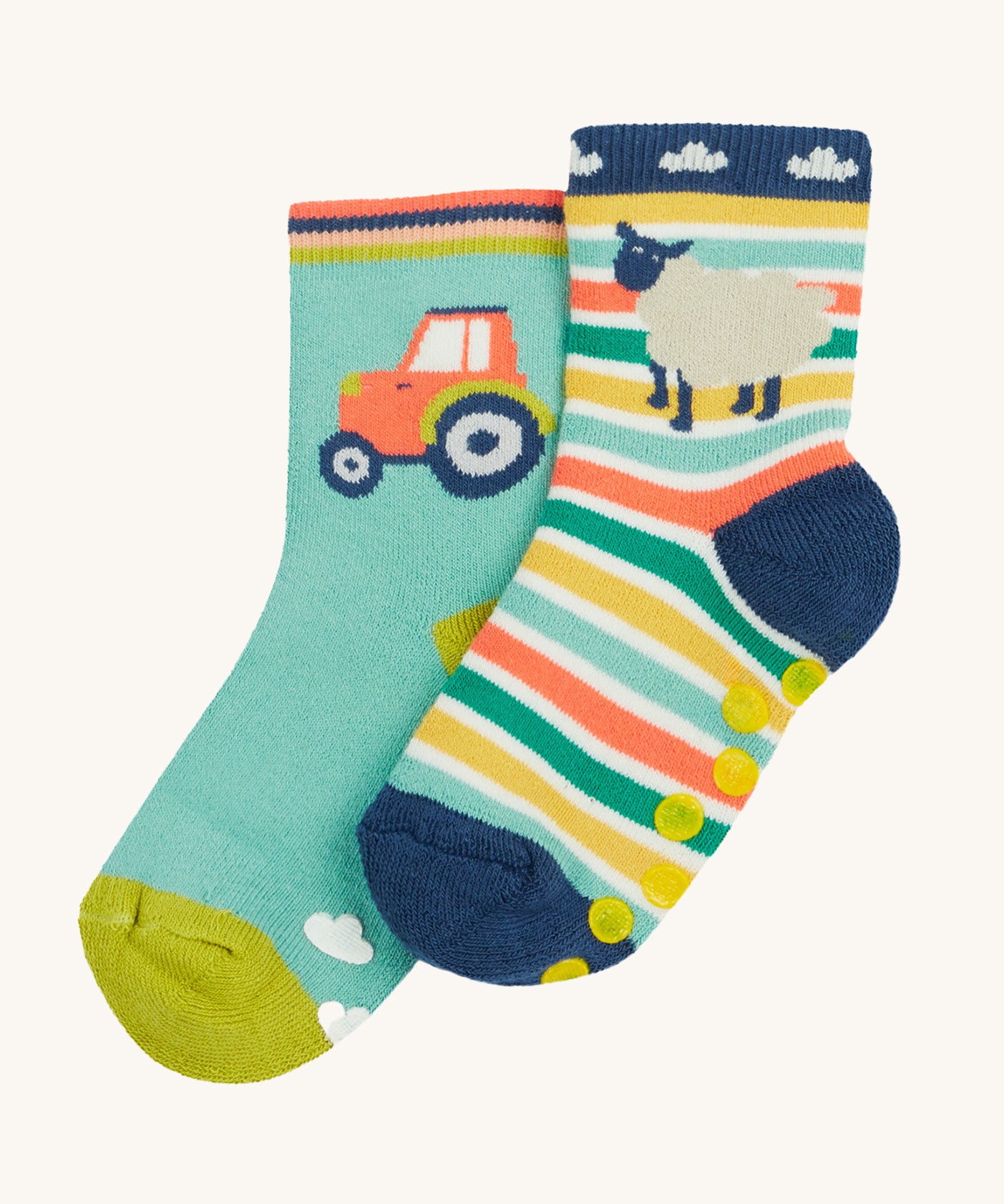 Frugi 2 pack grippy socks tractor and sheep design on a cream background