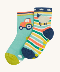 Frugi 2 pack grippy socks tractor and sheep design on a cream background