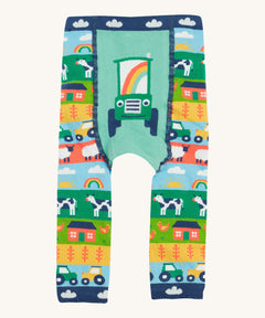 Frugi knitted leggings farm and tractor design on a cream background.