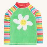 Frugi green stripe rash vest daisy design on a cream background.