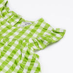 Close up of the Frugi little kids green gingham, donkey myrtle body dress - showing the gentle frill and back popper fastener detail on green and white gingham organic cotton fabric