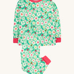 Frugi green pyjamas set busy bugs design on a cream background.