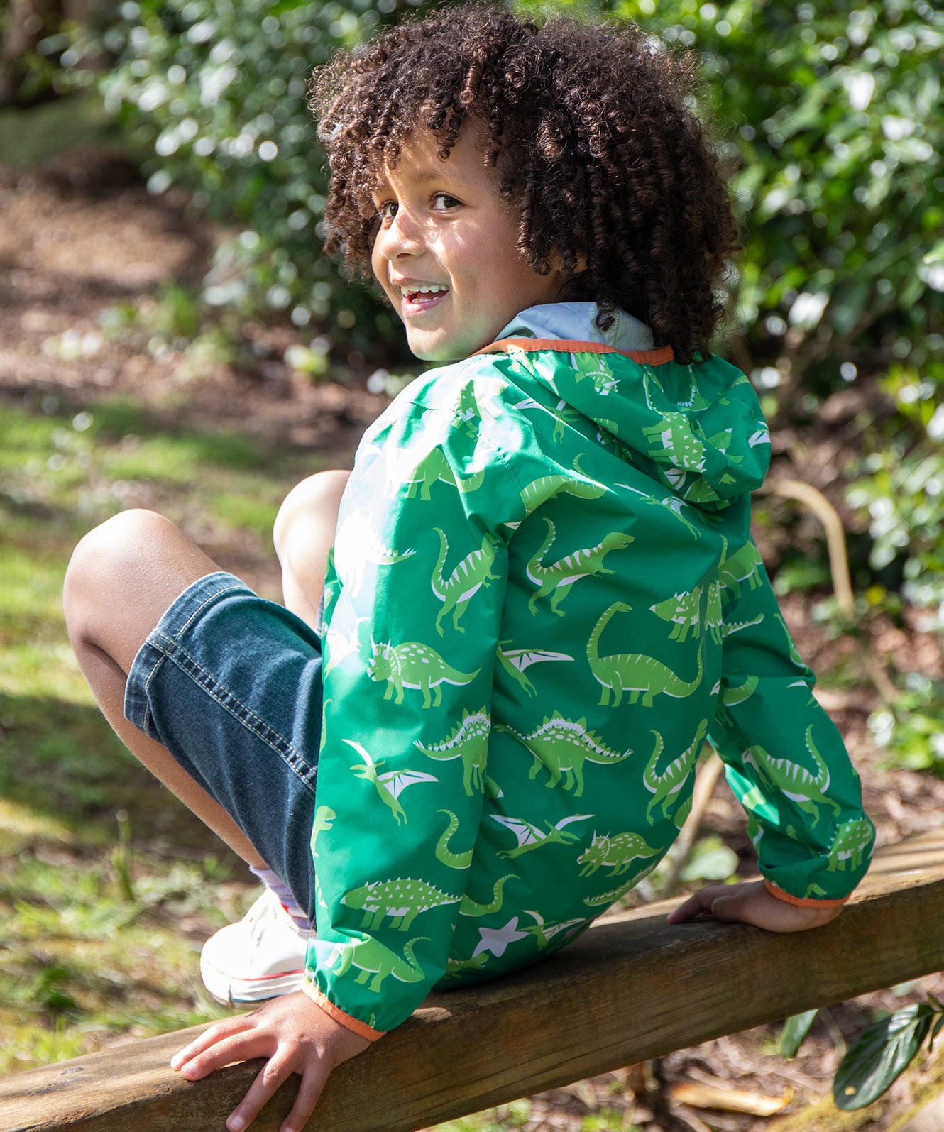 Frugi green rain jacket dino roar design