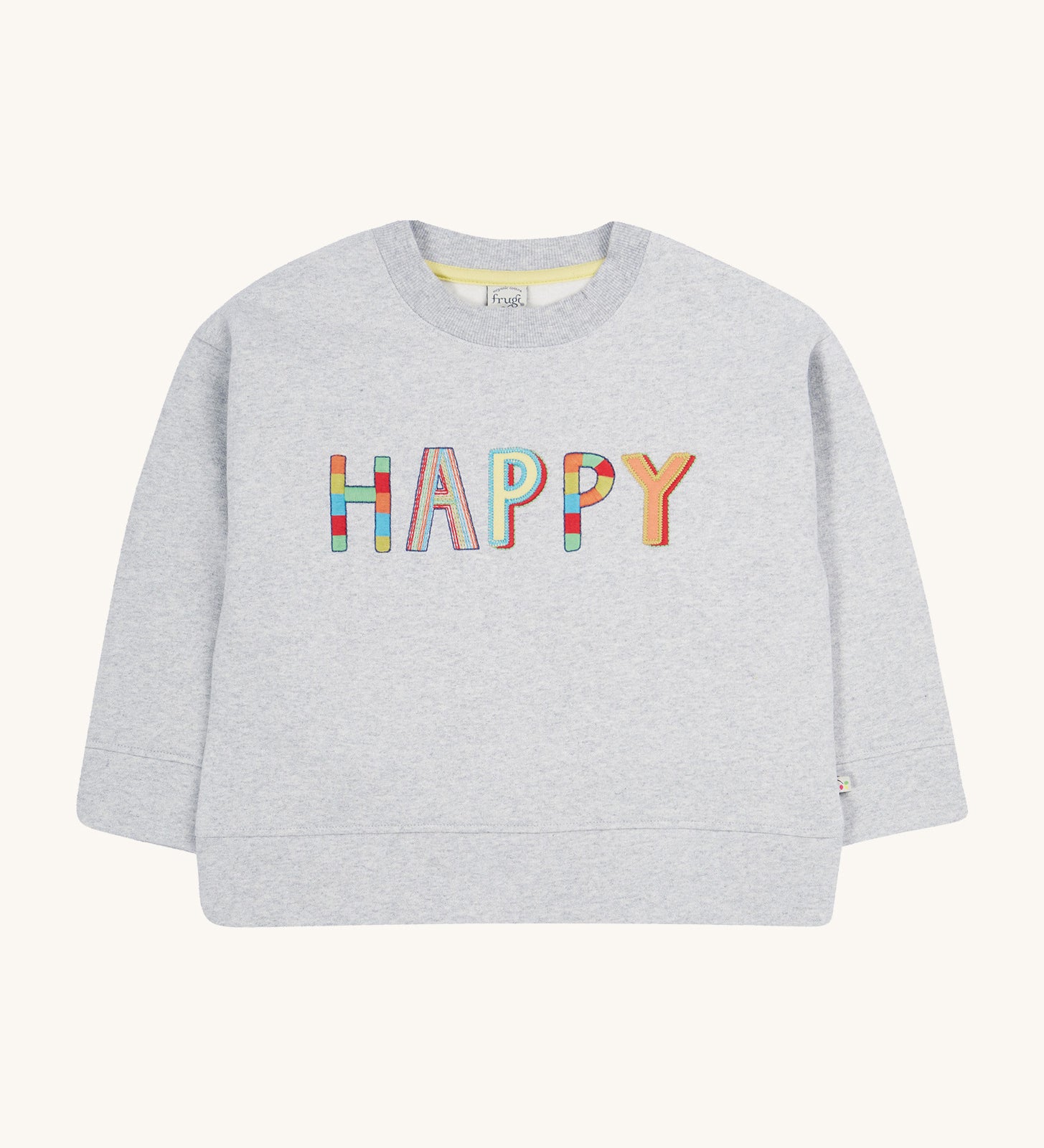 Frugi grey oversized sweater happy design on a cream background.