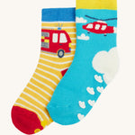 Frugi 2 pack grippy socks helicopter and fire engine design on a cream background.