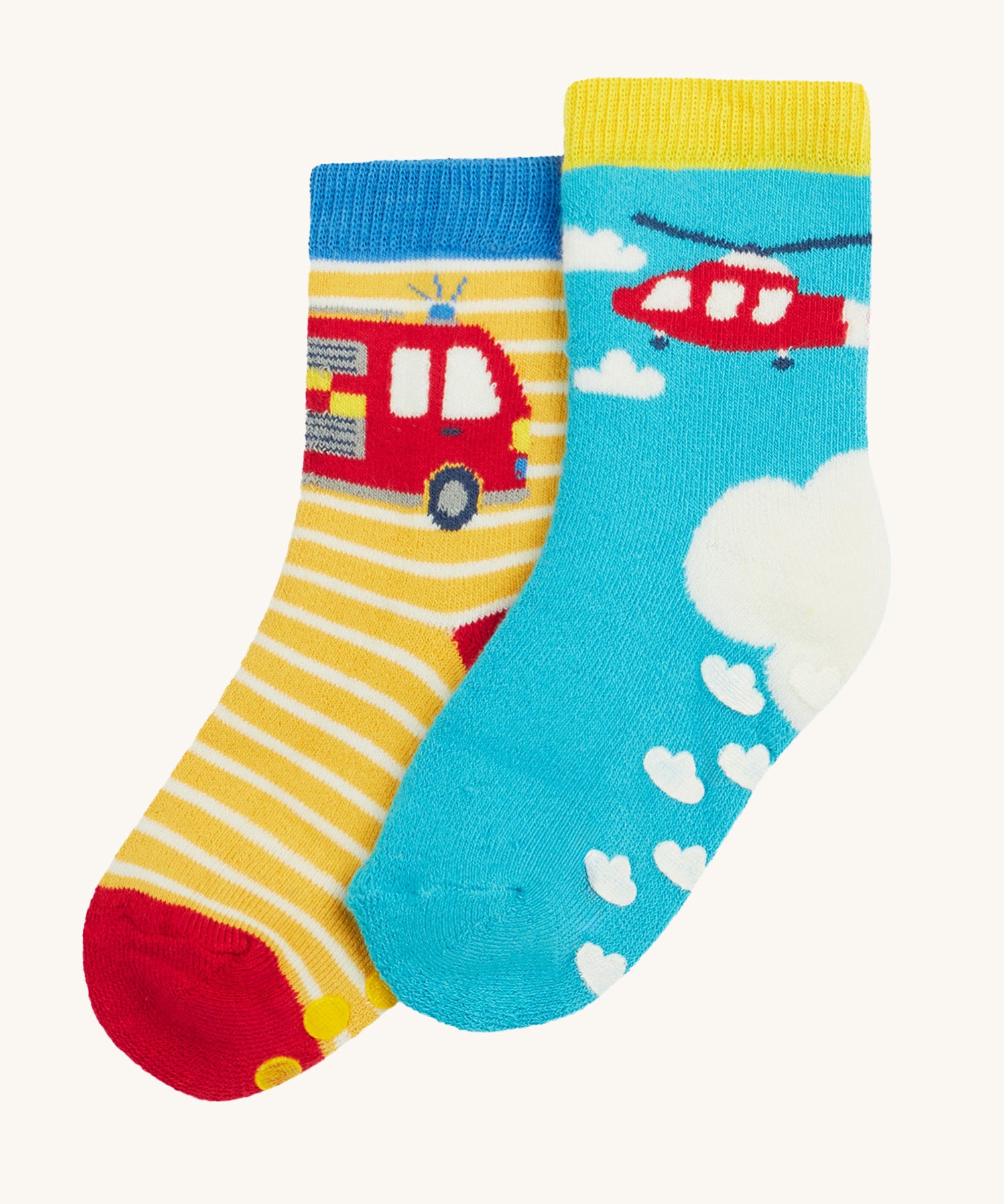 Frugi 2 pack grippy socks helicopter and fire engine design on a cream background.