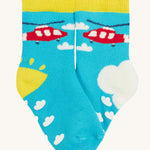 Frugi 2 pack grippy socks helicopter design on a cream background.