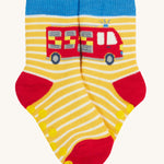 Frugi 2 pack grippy socks fire engine design on a cream background.