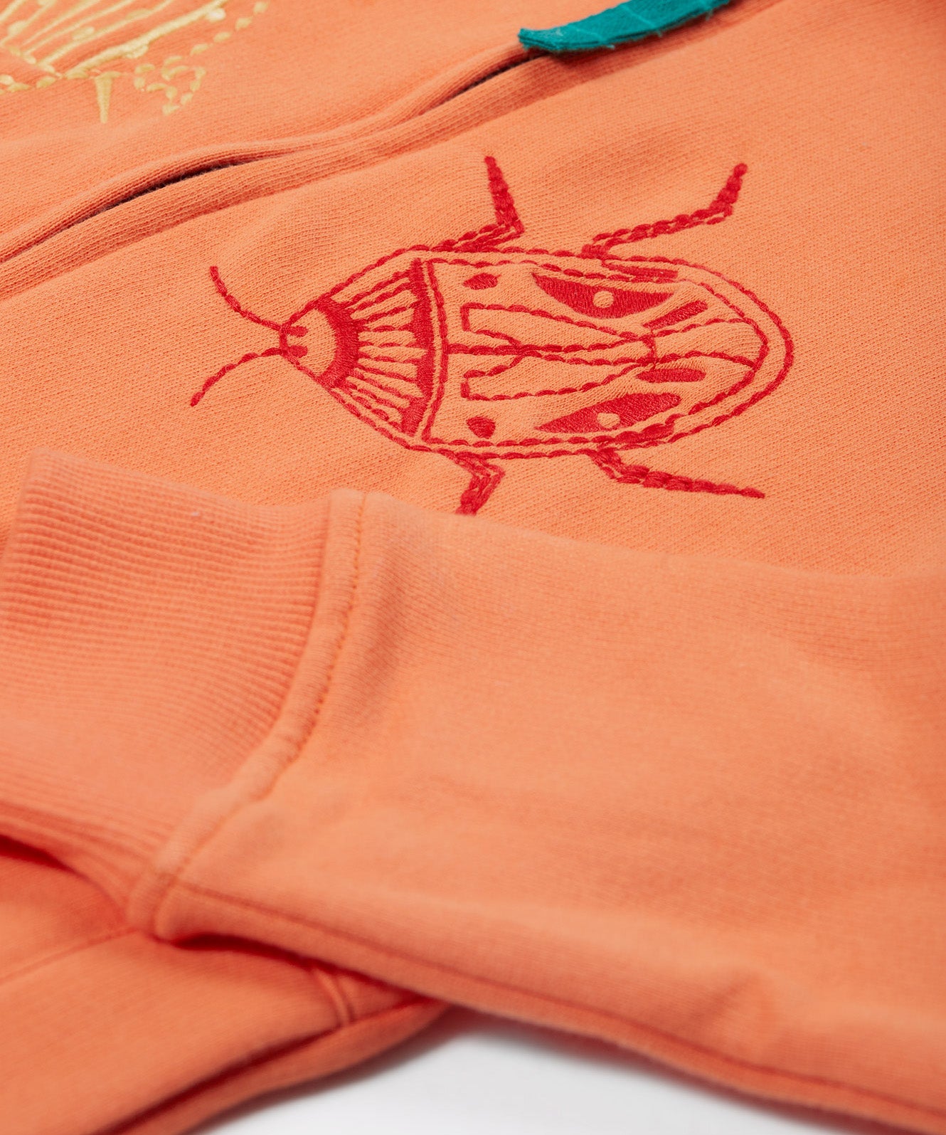 Frugi orange zip hoodie beetles design sleeve detail