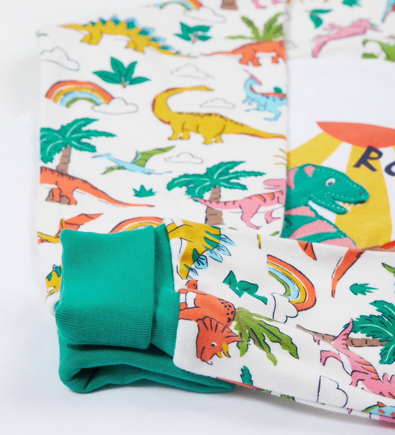 Frugi white pyjama set dinoland design cuff detail