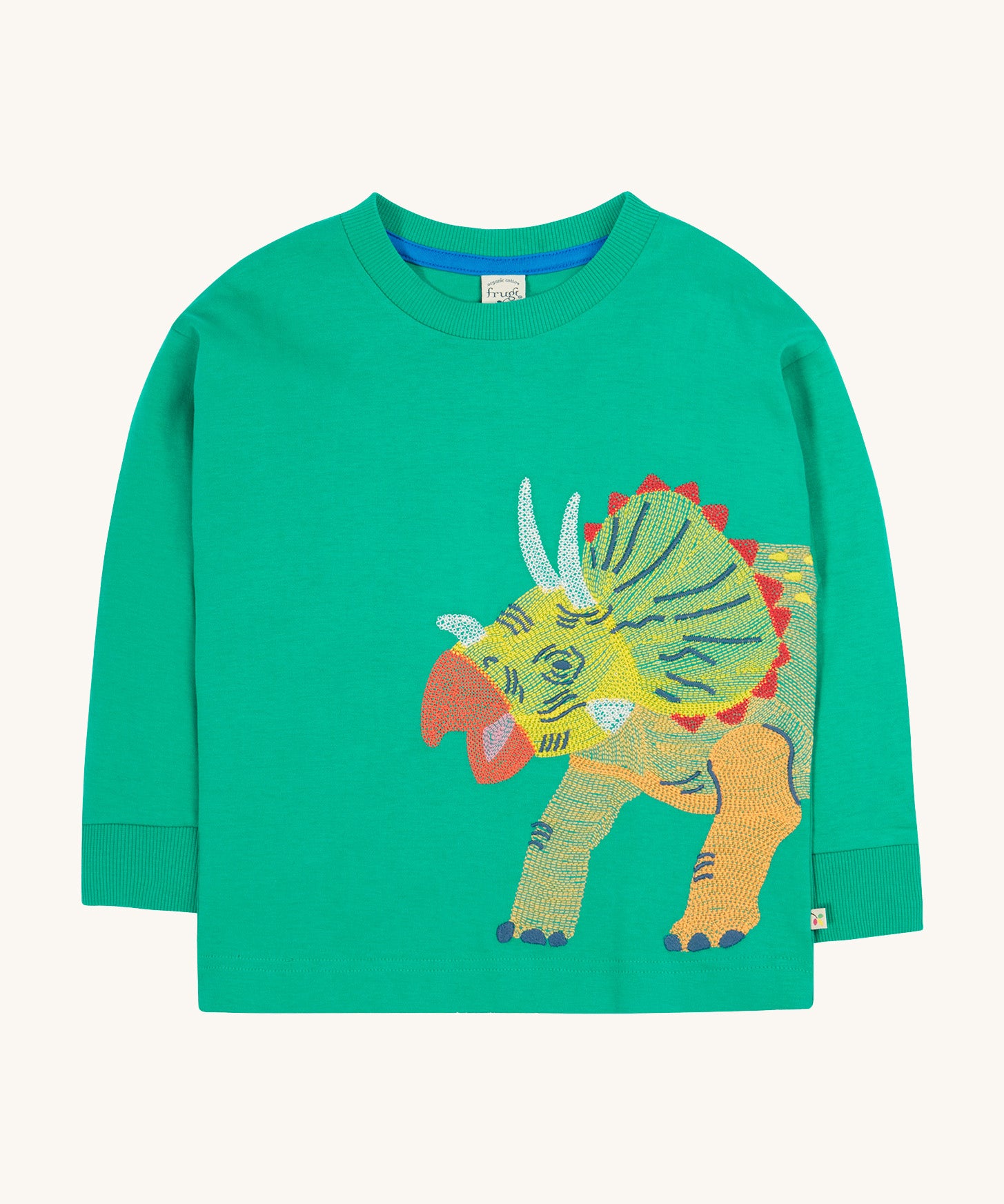 Frugi kids green stop in a green colour with a triceratops design on a cream bakground.