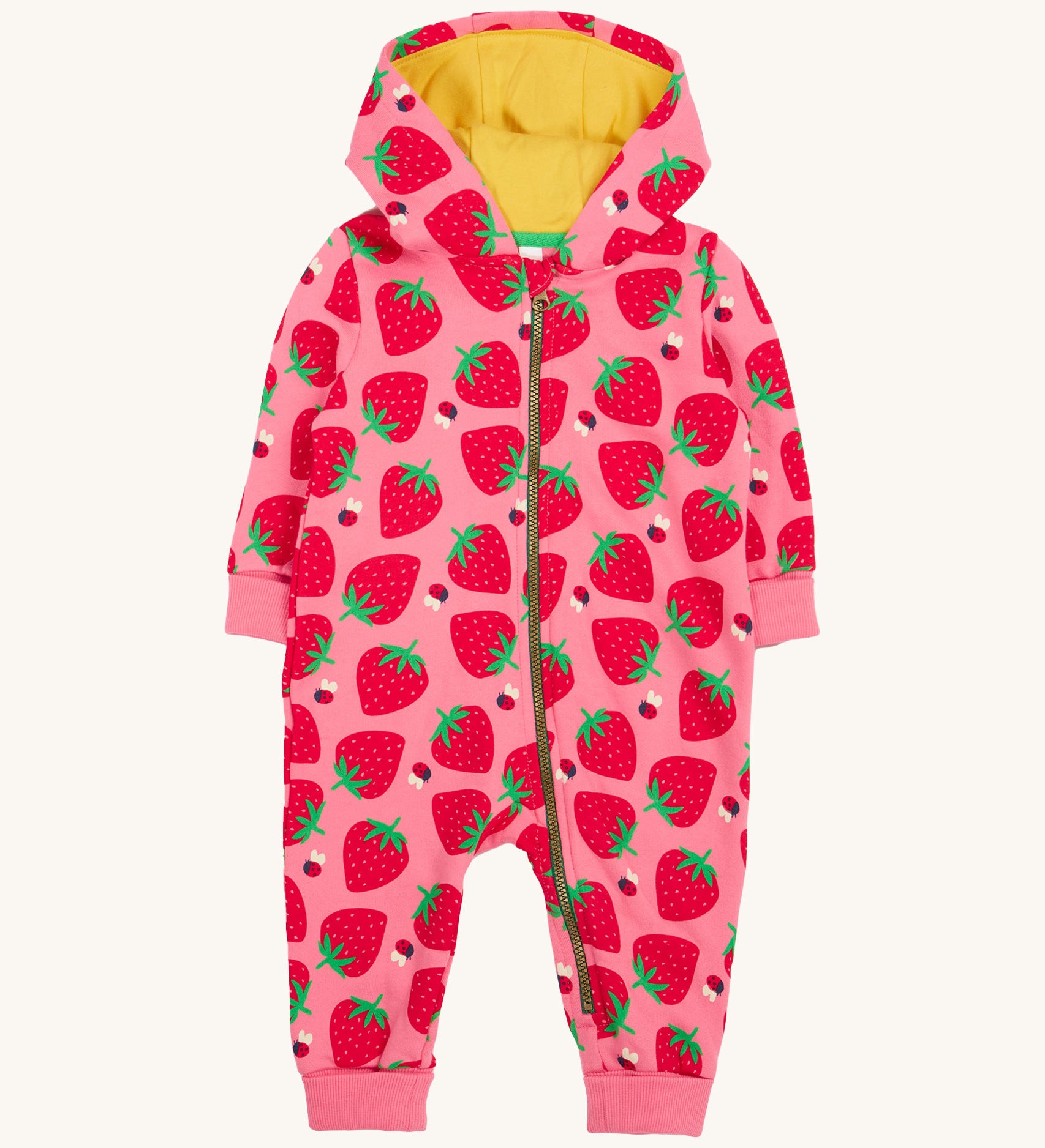 Frugi kids snuggle suit in strawberry design on a cream background