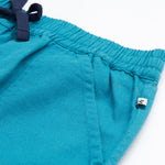 Frugi kids trousers in green, blue, turquoise colour pocket detail