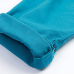 Frugi kids trousers in green, blue, turquoise colour turned up cuff detail