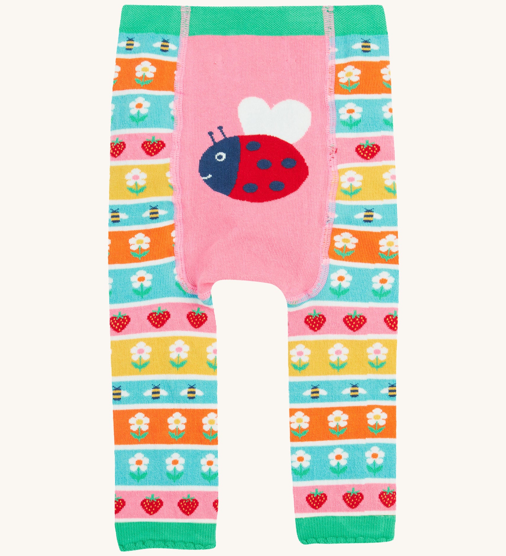 Frugi knitted leggings daisy and ladybird design on a cream background.