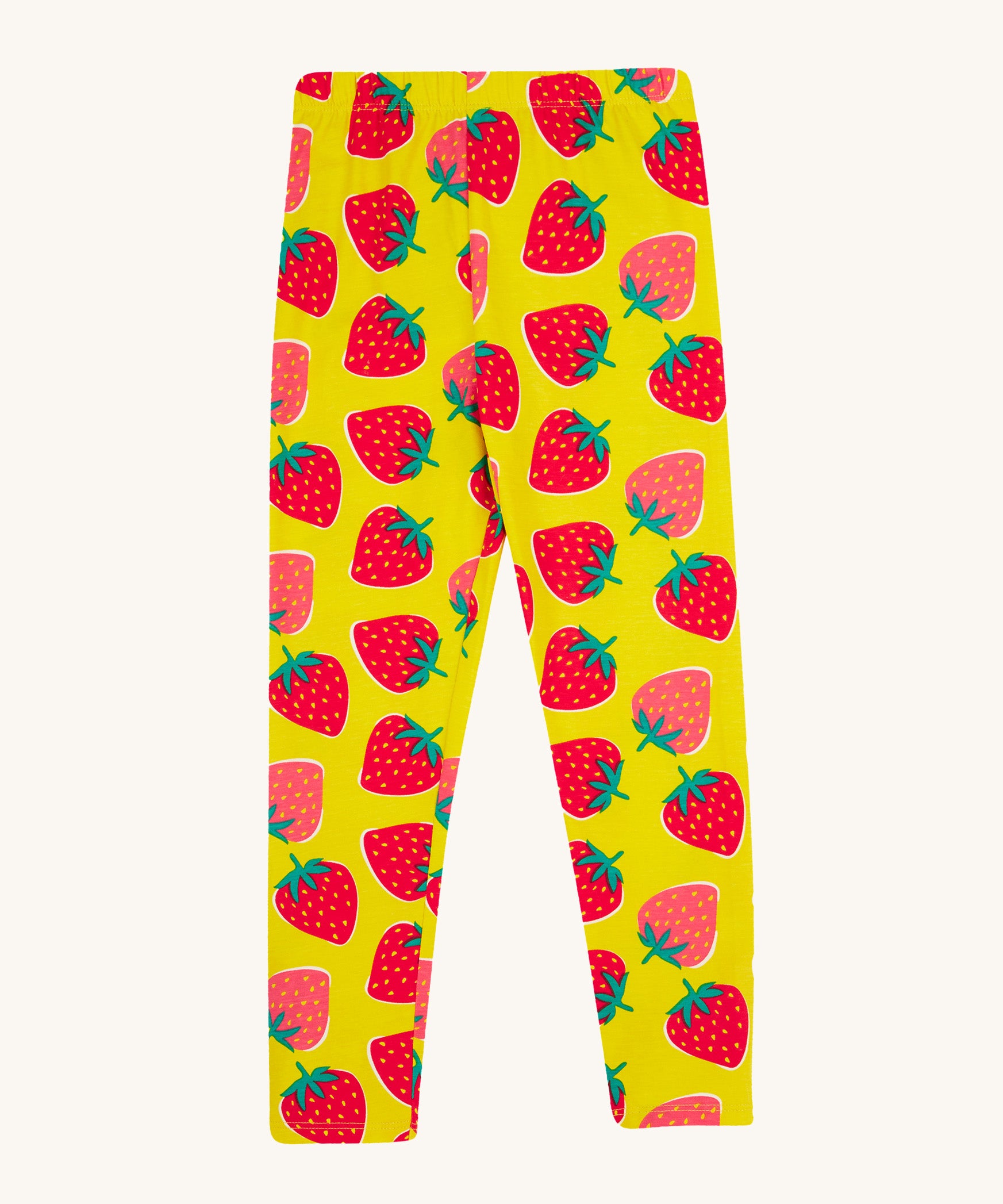 Frugi yellow leggings strawberry patch design on a cream background