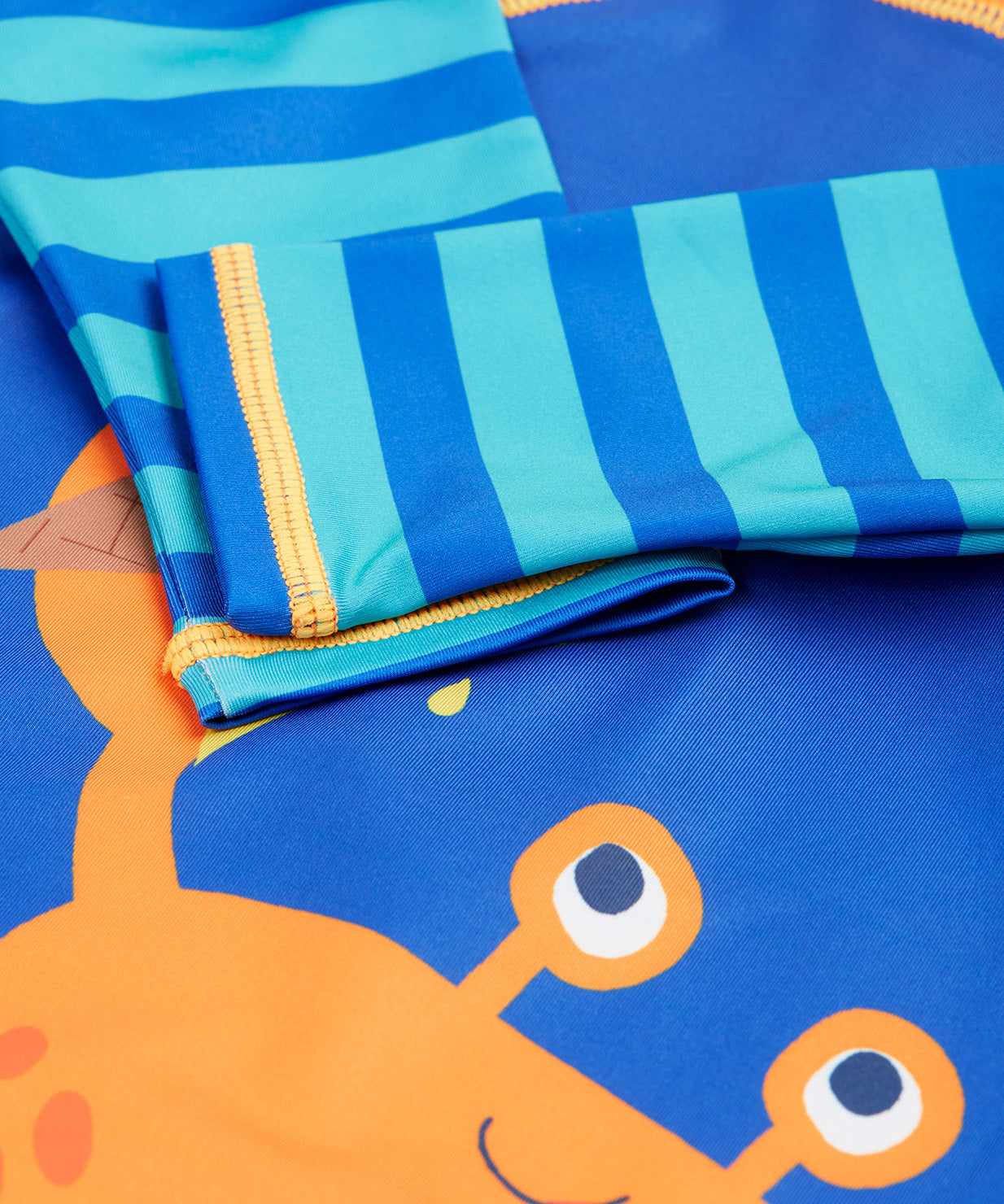 Frugi blue and orange little sun safe suit  crab cuff detail