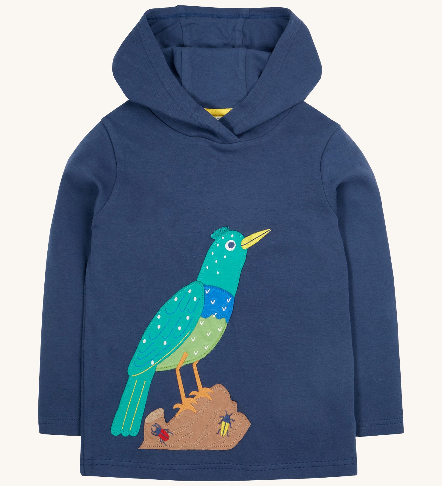 Frugi kids navy hooded top starling design on a cream background.