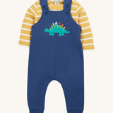 Frugi navy, yellow stripe dungaree outfit dino design on a cream background.