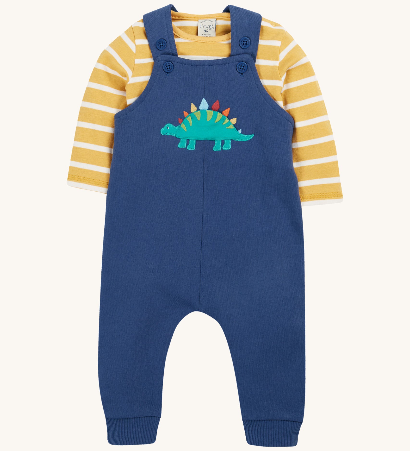 Frugi navy, yellow stripe dungaree outfit dino design on a cream background.