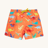 Frugi orange board shorts dino design on a cream background.