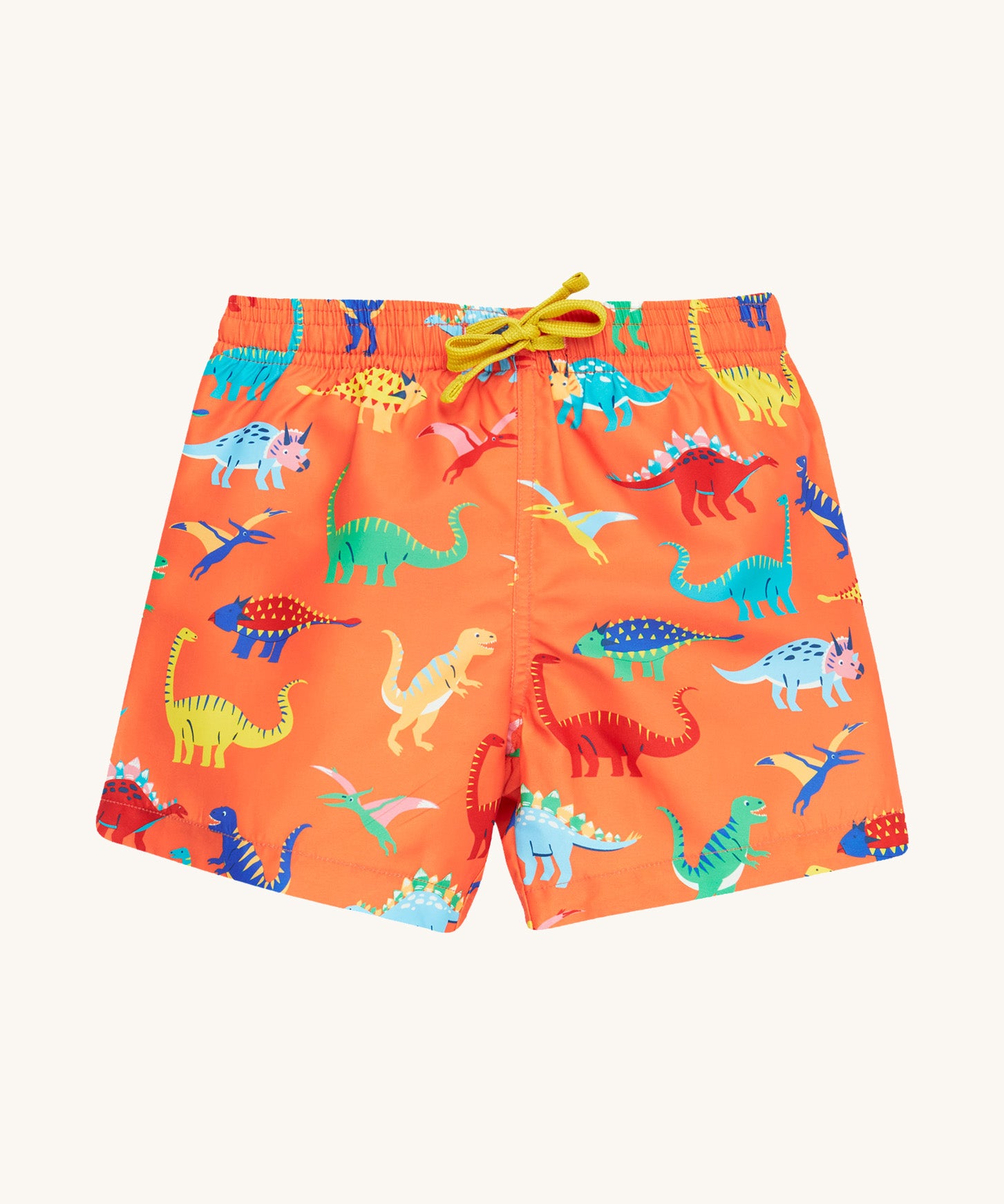 Frugi orange board shorts dino design on a cream background.