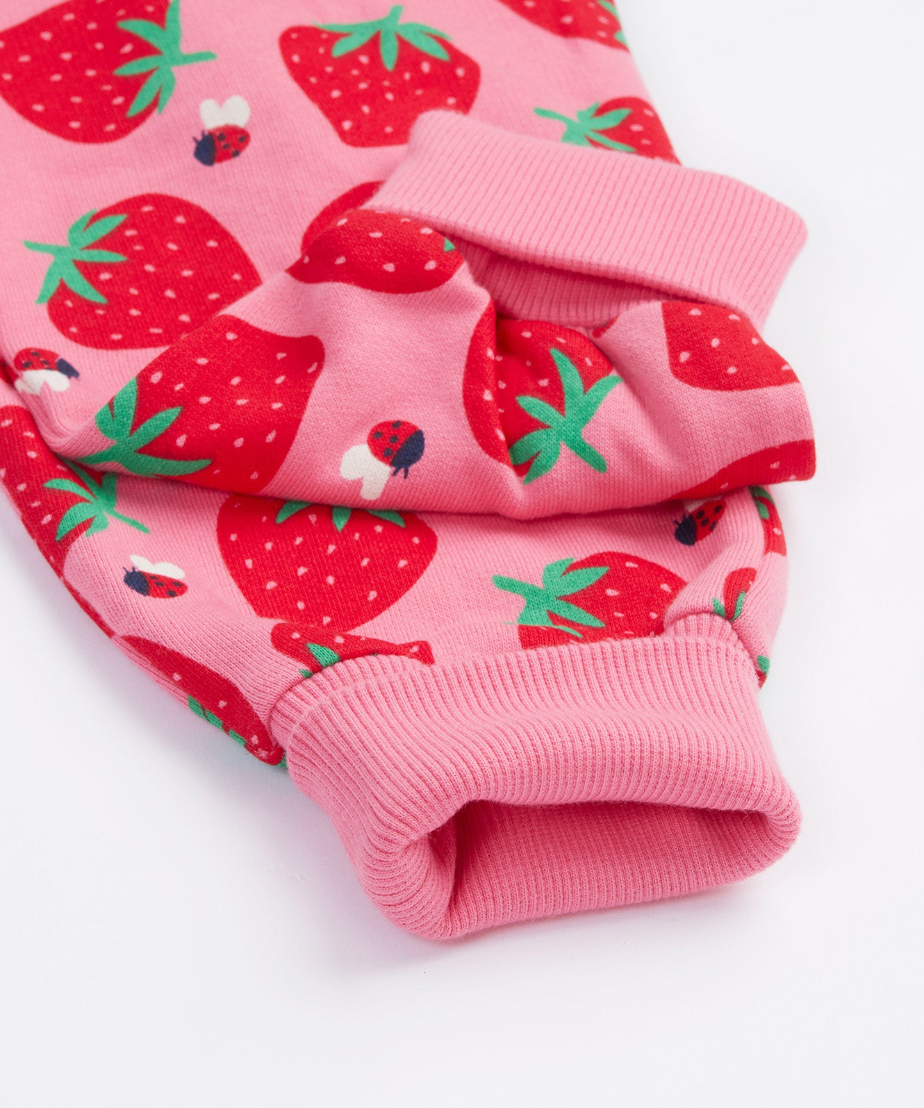 Frugi pink big snuggle suit strawberry pals leg cuff detail