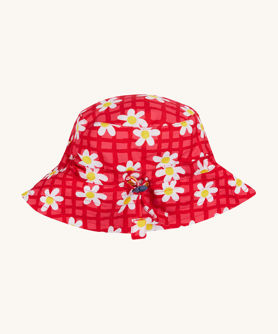 Frugi pink swim hat daisy chain design on a cream background.