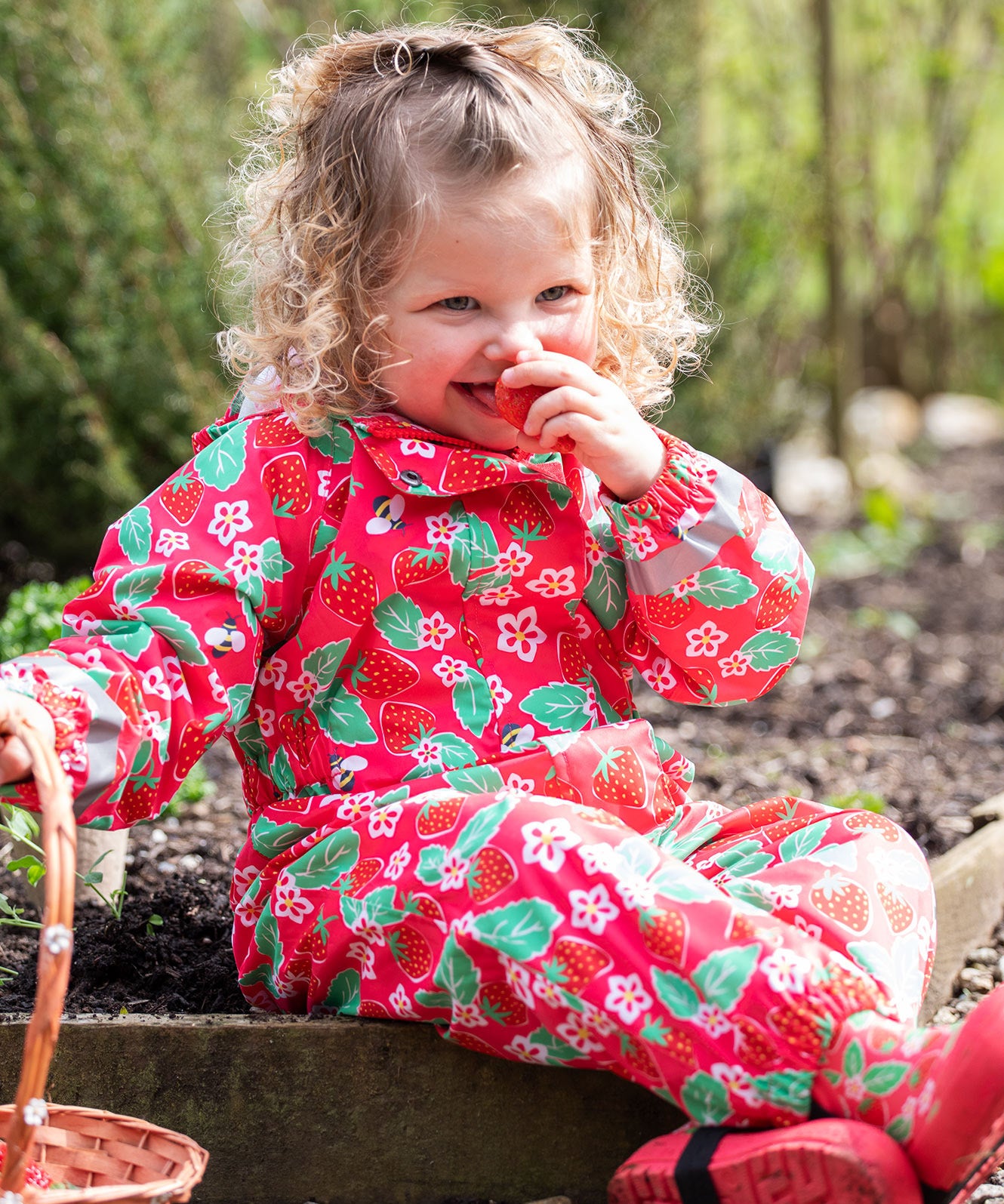 Frugi pink all in one suit strawberry pals 