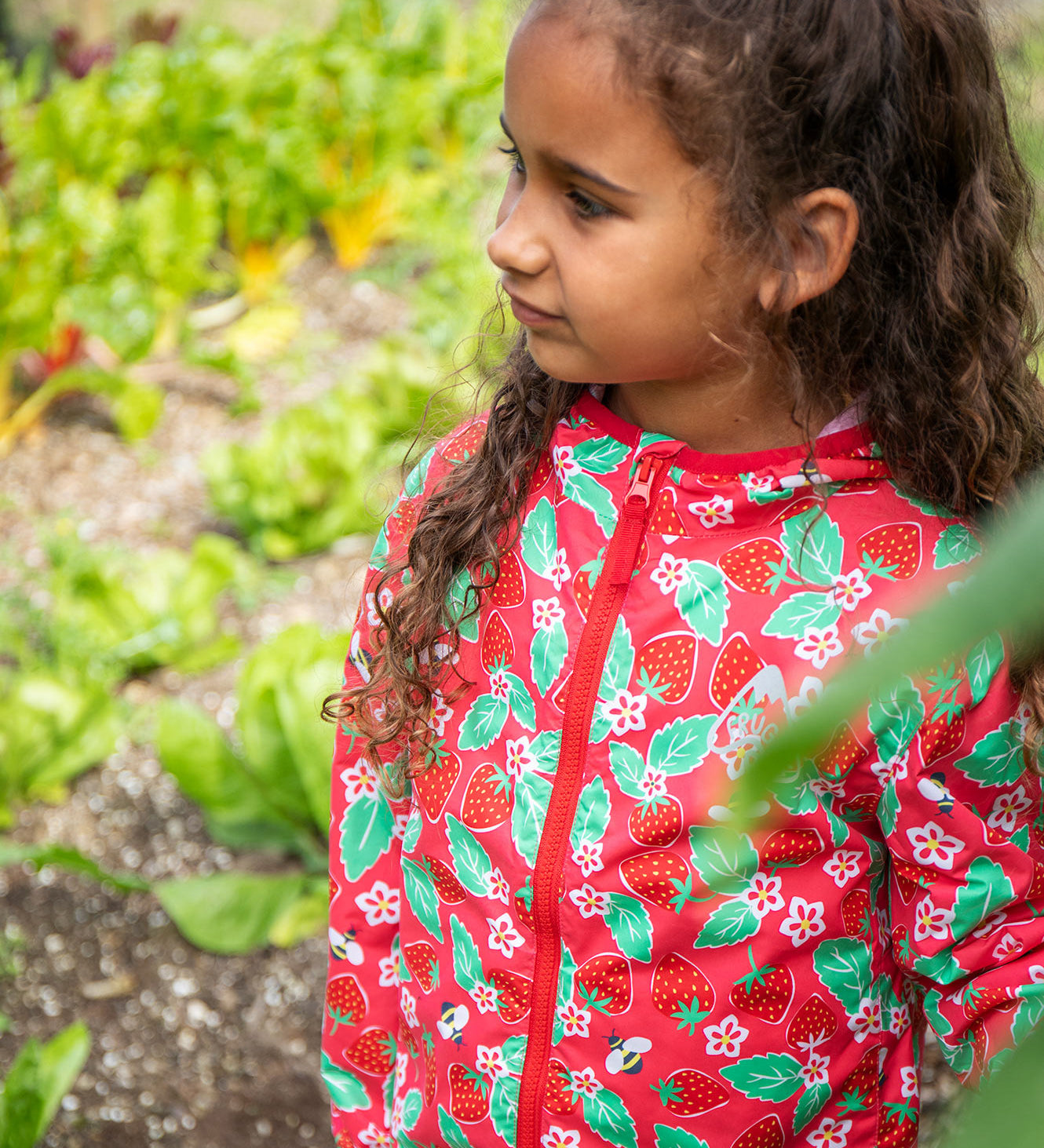 Frugi pink rain jacket strawberry pals design.