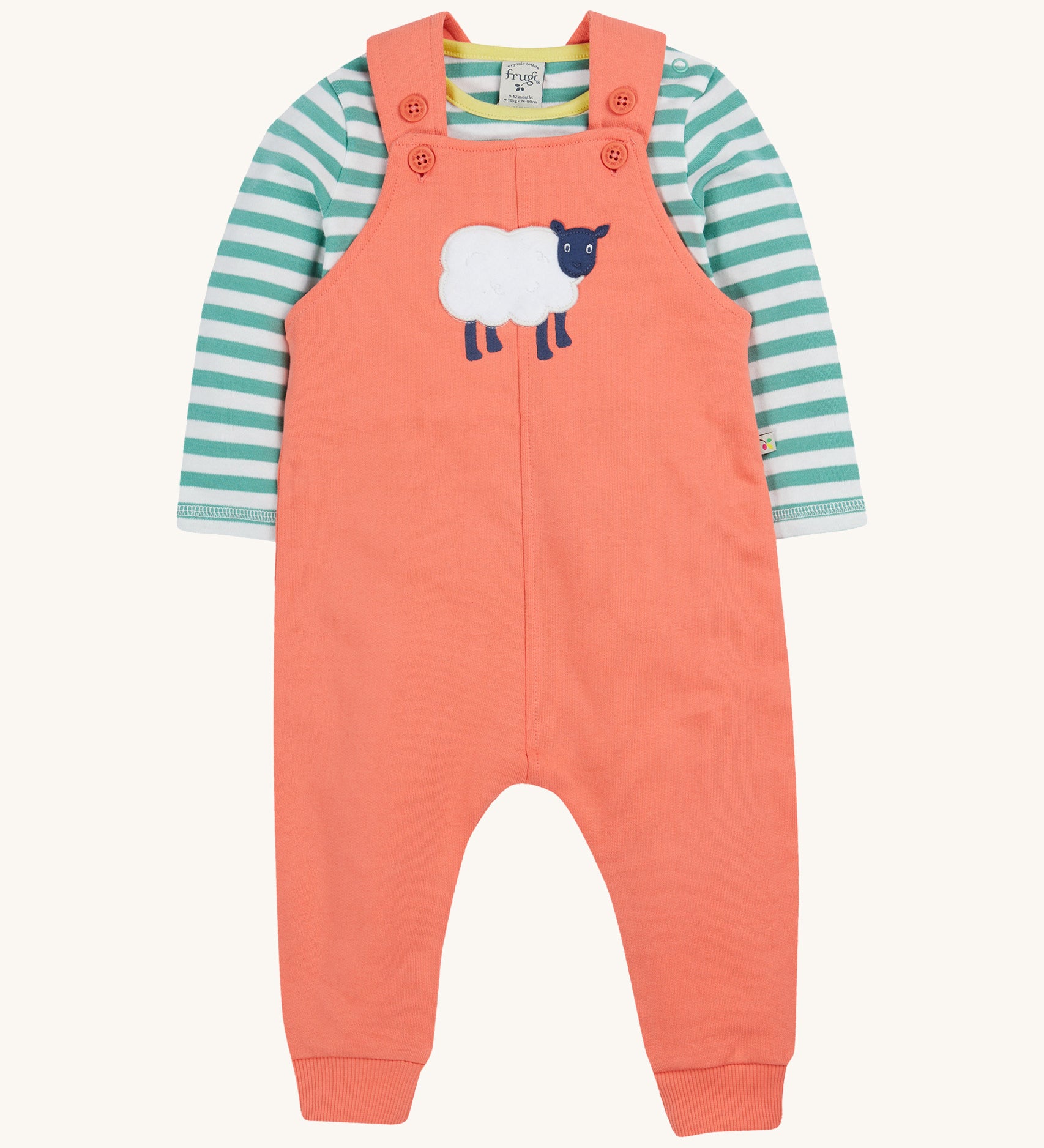 Frugi pink, green stripes dungaree outfit sheep design on a cream background.